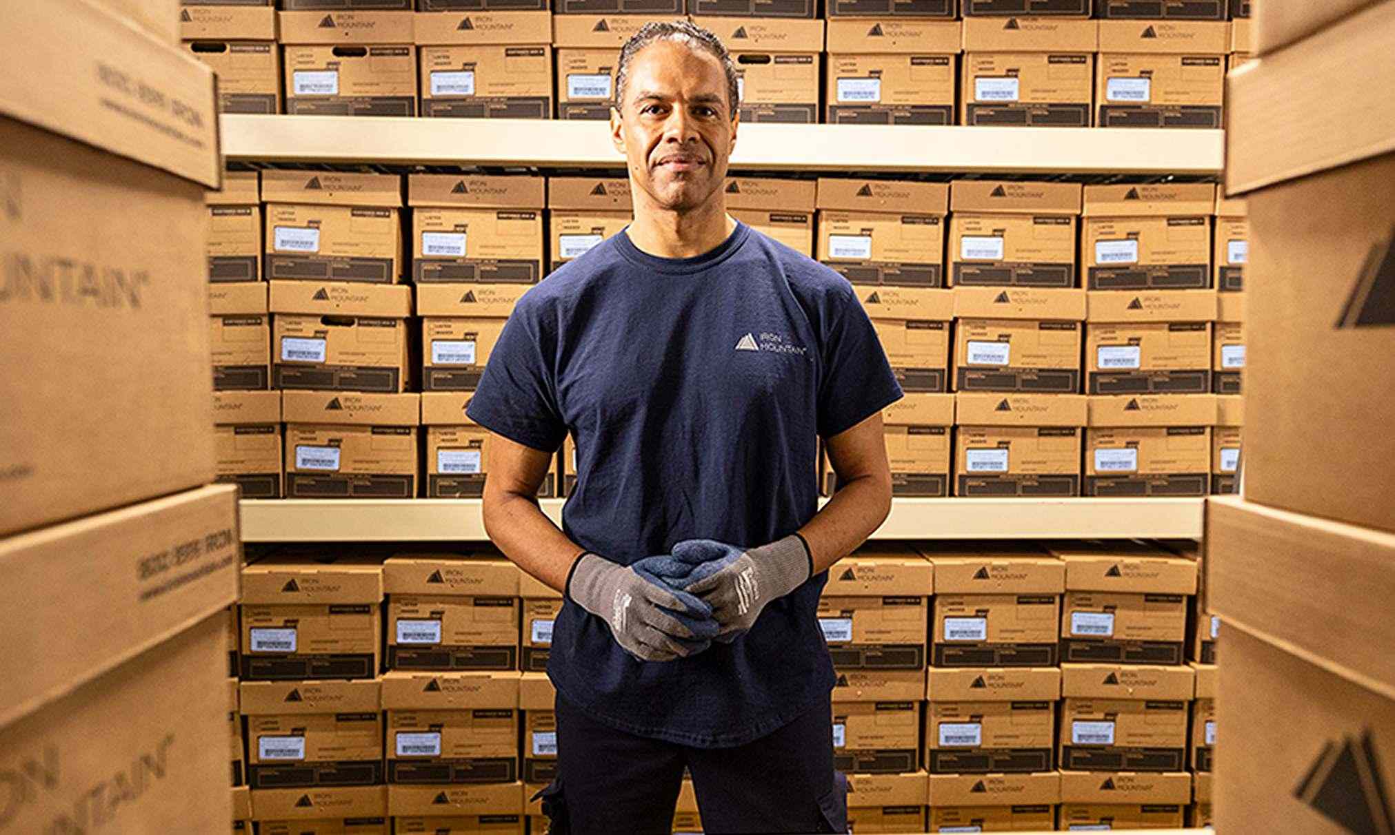 Man standing in front of boxes